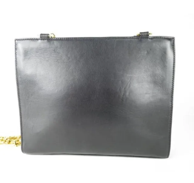 Reserved for Tammy. Vintage Gianni Versace black leather tote shoulder bag with big golden medusa motif and gold tone long chain straps. Too Gorgeous like Lady Gaga.
