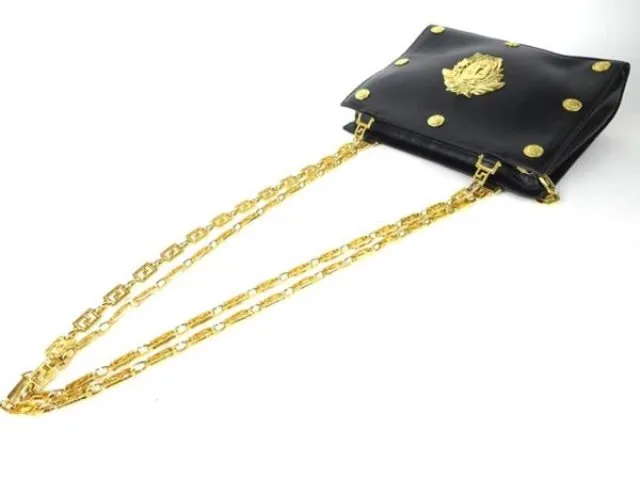 Reserved for Tammy. Vintage Gianni Versace black leather tote shoulder bag with big golden medusa motif and gold tone long chain straps. Too Gorgeous like Lady Gaga.