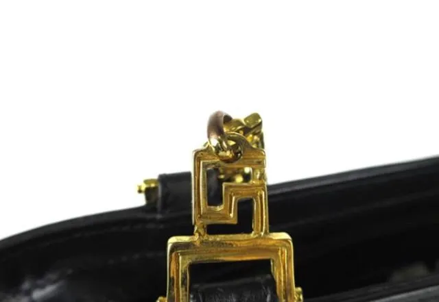 Reserved for Tammy. Vintage Gianni Versace black leather tote shoulder bag with big golden medusa motif and gold tone long chain straps. Too Gorgeous like Lady Gaga.