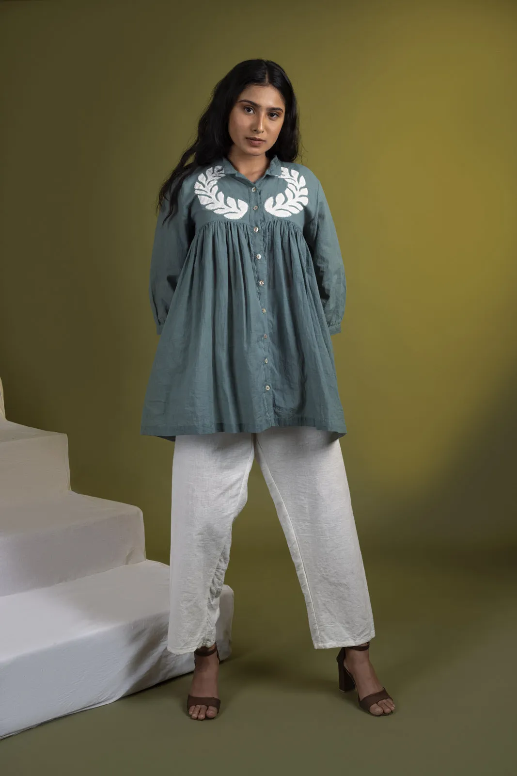 Teal applique gathered top with white pants