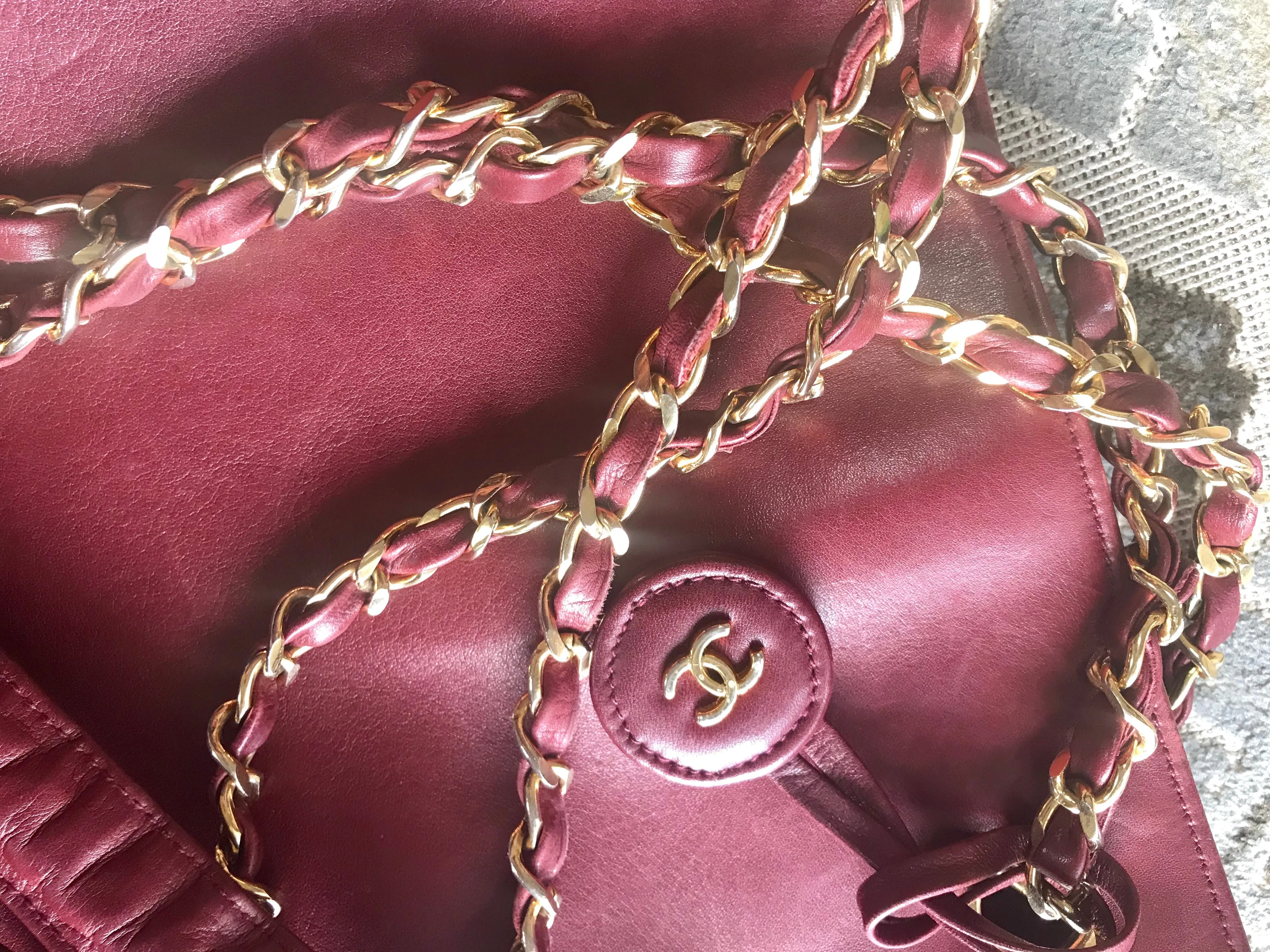 Vintage CHANEL wine leather tote bag with gold chain handles and CC motif charm. Classic purse.