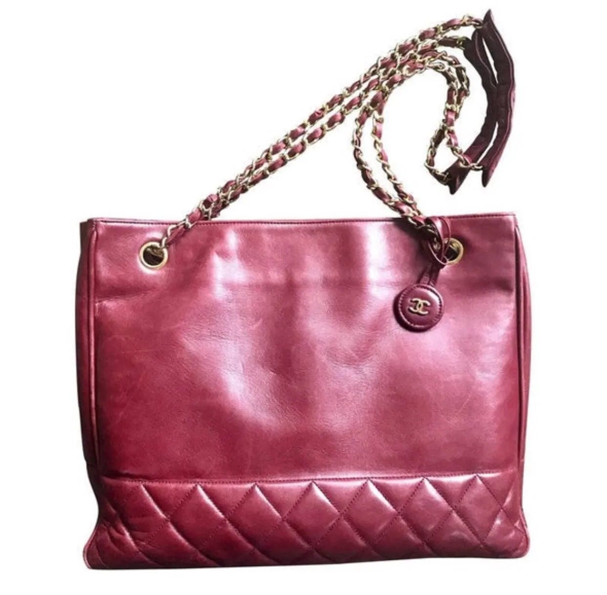 Vintage CHANEL wine leather tote bag with gold chain handles and CC motif charm. Classic purse.